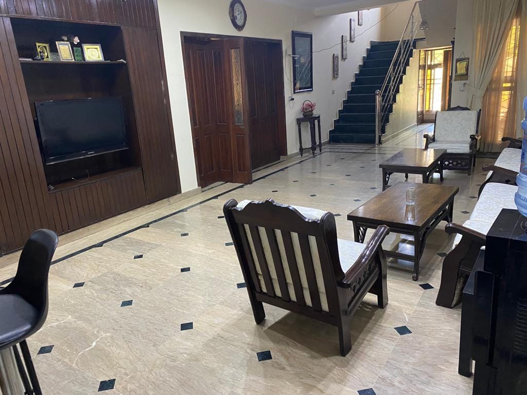 1 Kanal double-story house for sale 10 years used marble flooring in Wapda Town Phase 1 Lahore